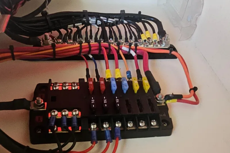 Slide: The Image of Electrical wiring and fuse panel in a 2017 Grady-White Fisherman 257 boat. - 22