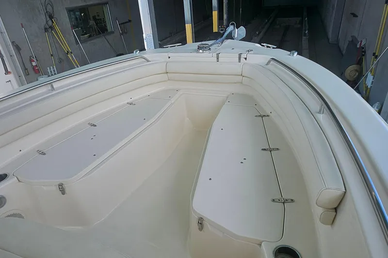 Slide: The Image of 2017 Grady-White Fisherman 257 boat interior with cushioned seating and storage compartments. - 24