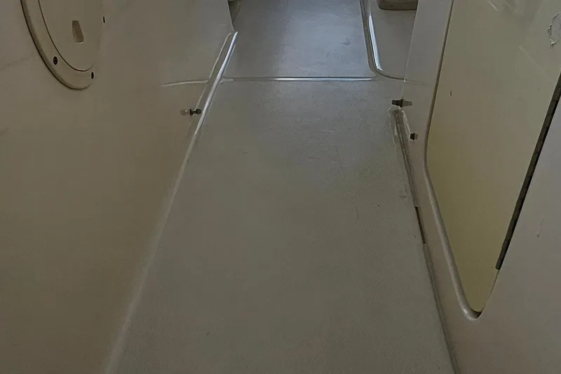 Slide: The Image of Interior view of 2017 Grady-White Fisherman 257 boat, showcasing deck and storage area. - 28