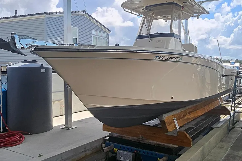 Slide: The Image of 2017 Grady-White Fisherman 257 boat on a lift, dockside view. - 3