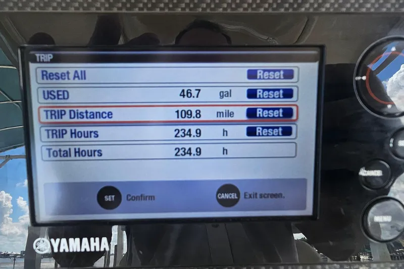 Slide: The Image of Yamaha display showing trip data: 46.7 gallons used, 109.8 miles traveled, 234.9 hours. Grady-White Fisherman 257, 2017. - 35