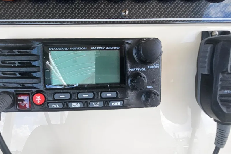 Slide: The Image of Standard Horizon Matrix AIS/GPS radio on 2017 Grady-White Fisherman 257 boat dashboard. - 39
