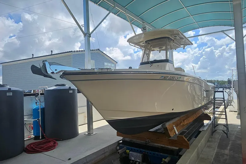 Slide: The Image of 2017 Grady-White Fisherman 257 boat on a lift under a canopy. - 4