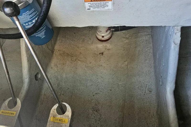 Slide: The Image of Interior view of a 2017 Grady-White Fisherman 257 boat, showing washdown and livewell controls. - 41