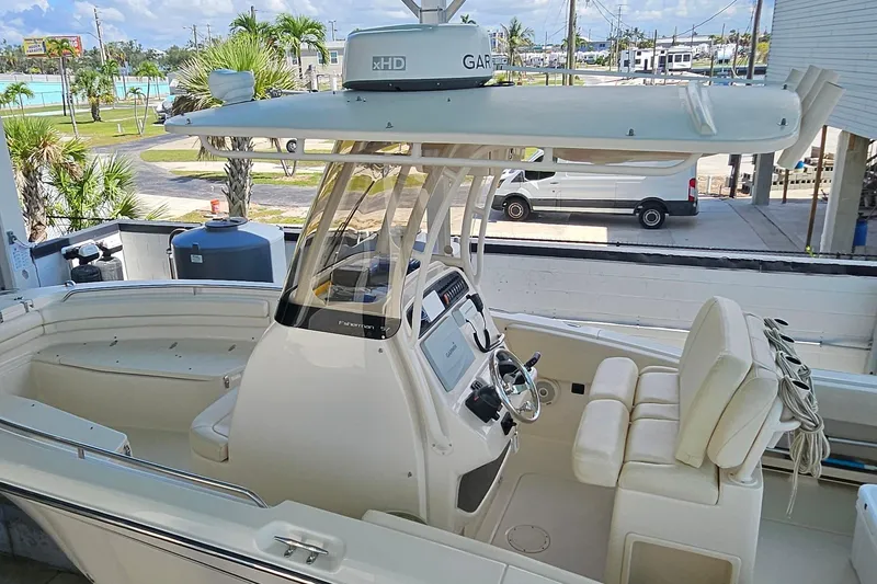 Slide: The Image of 2017 Grady-White Fisherman 257 boat with modern console and seating, docked outdoors. - 46