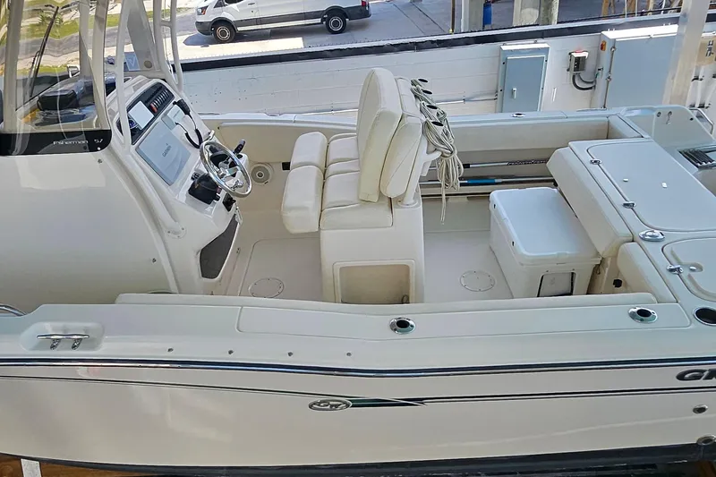 Slide: The Image of 2017 Grady-White Fisherman 257 boat interior with helm, seating, and storage compartments. - 47