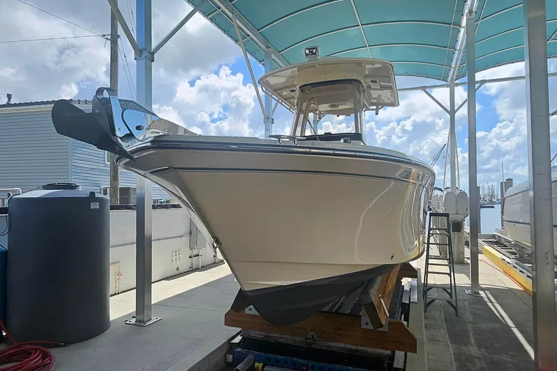 Slide: The Image of 2017 Grady-White Fisherman 257 boat under a canopy at a marina. - 5