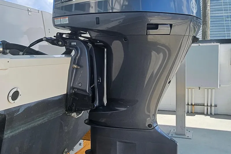 Slide: The Image of 2017 Grady-White Fisherman 257 boat engine close-up in a sunny outdoor setting. - 7