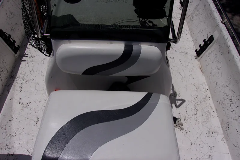 Slide: The Image of 2011 Blue Wave 180 Super Tunnel boat interior with patterned seats and console. - 10