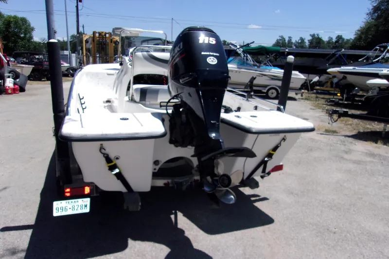 Slide: The Image of 2011 Blue Wave 180 Super Tunnel boat with outboard motor, parked on a trailer. - 3