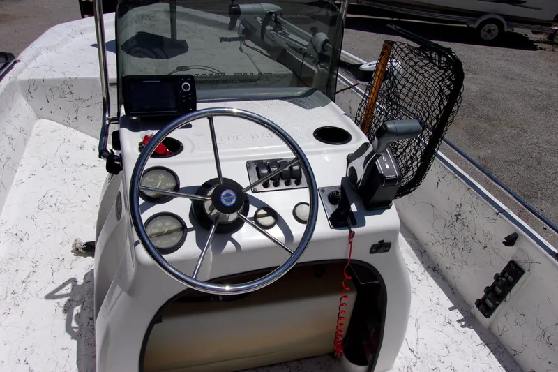 Slide: The Image of 2011 Blue Wave 180 Super Tunnel boat console with steering wheel and controls. - 4