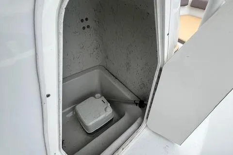 Slide: The Image of 2019 Key Largo 2100 WI boat storage compartment with portable toilet. - 11