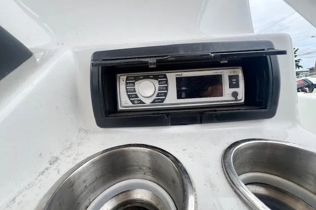 Slide: The Image of Boat dashboard with stereo system and cup holders, Key Largo 2100 WI, 2019 model. - 4