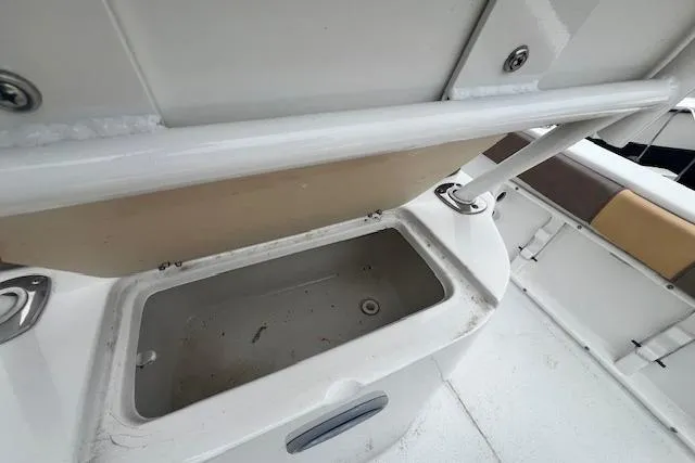 Slide: The Image of Open storage compartment on 2019 Key Largo 2100 WI boat. - 8