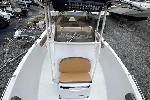 Slide: The Image of 2019 Key Largo 2100 WI boat with seating and console, parked on gravel. - 9