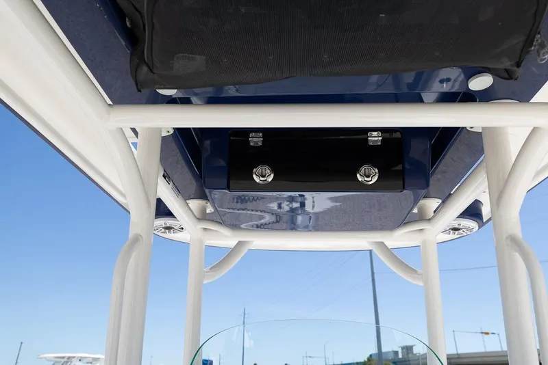 Slide: The Image of 2022 Caymas 26 HB boat T-top structure with speakers and storage compartment. - 21
