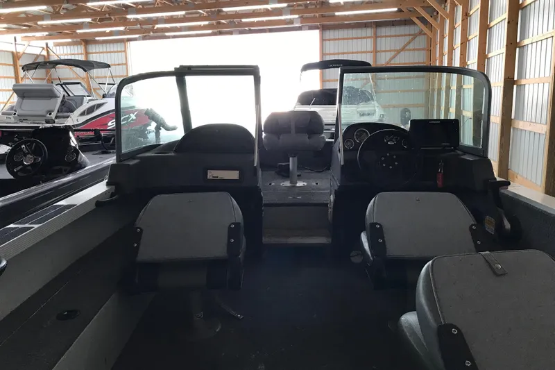 Slide: The Image of 2009 Triton DV 17 Liberty boat interior in a storage facility. - 10