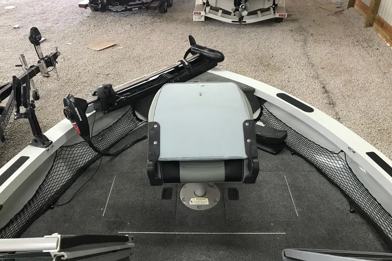 Slide: The Image of 2009 Triton DV 17 Liberty boat interior with seating and fishing equipment. - 18