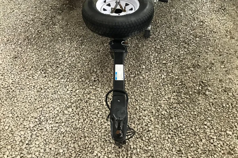 Slide: The Image of Trailer hitch with spare tire on gravel, Triton DV 17 Liberty, 2009 model. - 21