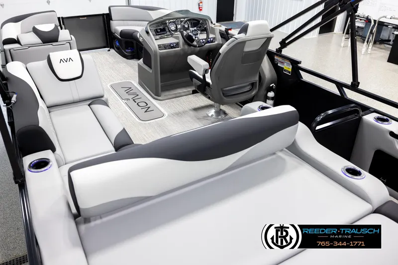Slide: The Image of Interior of 2026 Avalon LSZ VRB pontoon boat with luxurious seating and modern dashboard. - 11