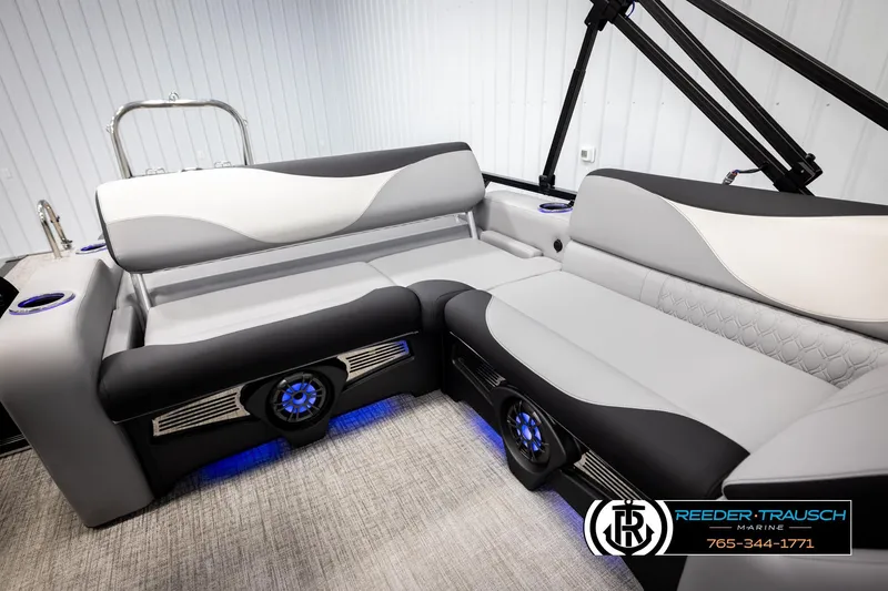 Slide: The Image of 2026 Avalon LSZ VRB boat interior with modern seating and blue LED lighting. - 21