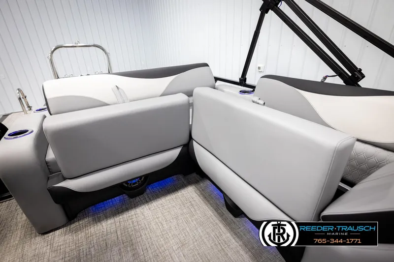 Slide: The Image of 2026 Avalon LSZ VRB boat interior with gray seating and blue LED lighting. - 22