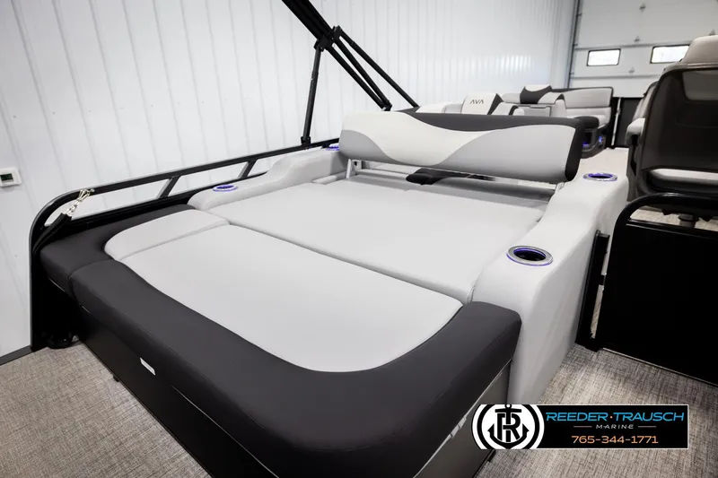 Slide: The Image of 2026 Avalon LSZ VRB pontoon boat interior with luxurious seating and cup holders. - 26