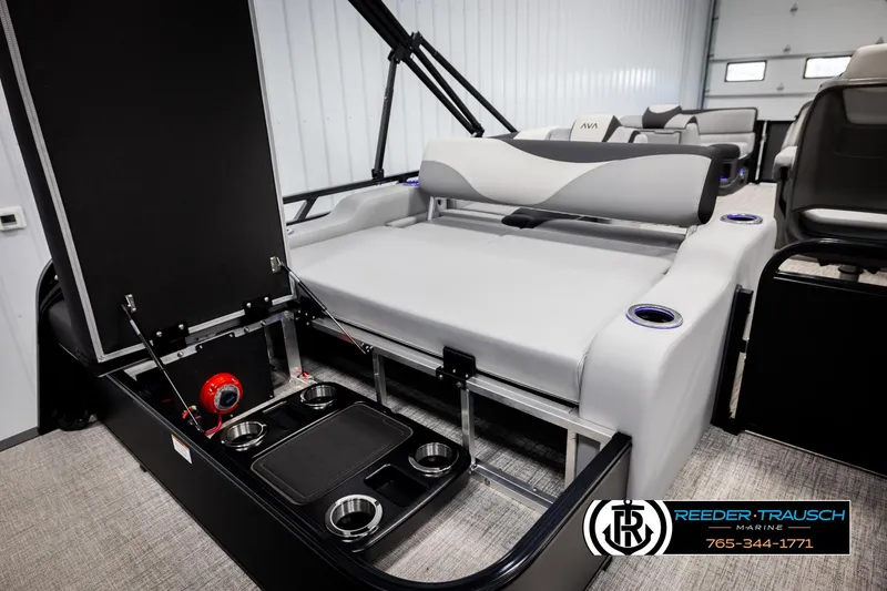 Slide: The Image of 2026 Avalon LSZ VRB boat interior with seating, cup holders, and storage compartment. - 27