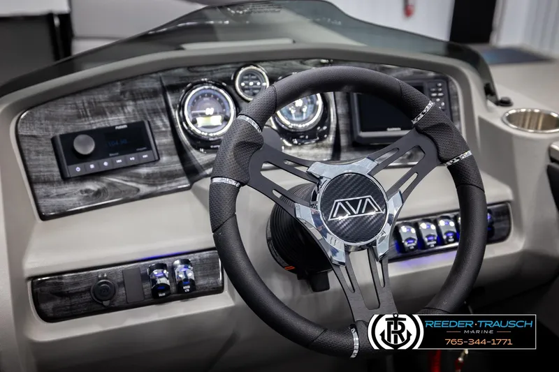 Slide: The Image of Steering wheel and dashboard of 2026 Avalon LSZ VRB boat, featuring modern controls and gauges. - 34