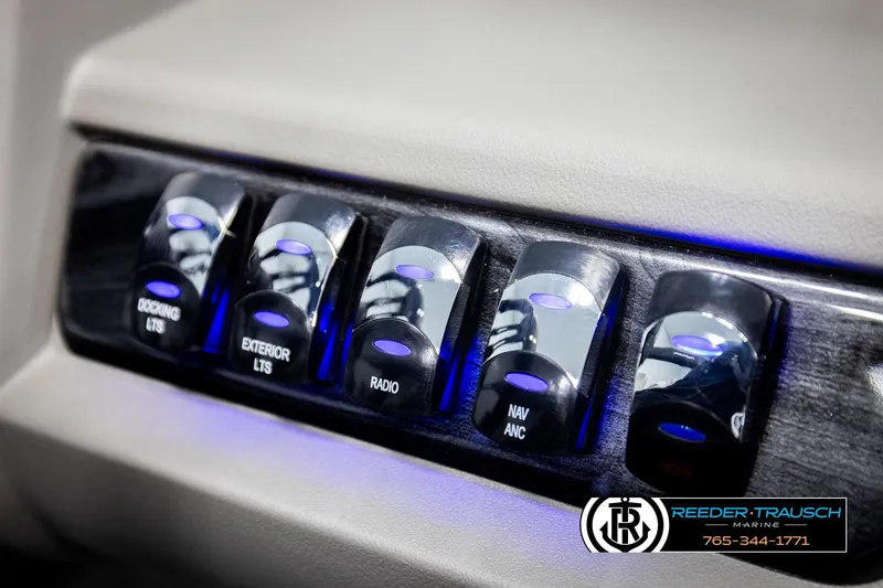 Slide: The Image of Control panel of 2026 Avalon LSZ VRB with illuminated switches for docking, exterior lights, and radio. - 40