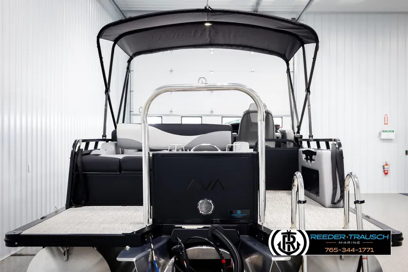 Slide: The Image of 2026 Avalon LSZ VRB pontoon boat with canopy in a showroom. - 7