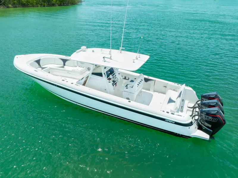 Slide: The Image of 2018 Intrepid 375 Open boat on clear turquoise water. - 10