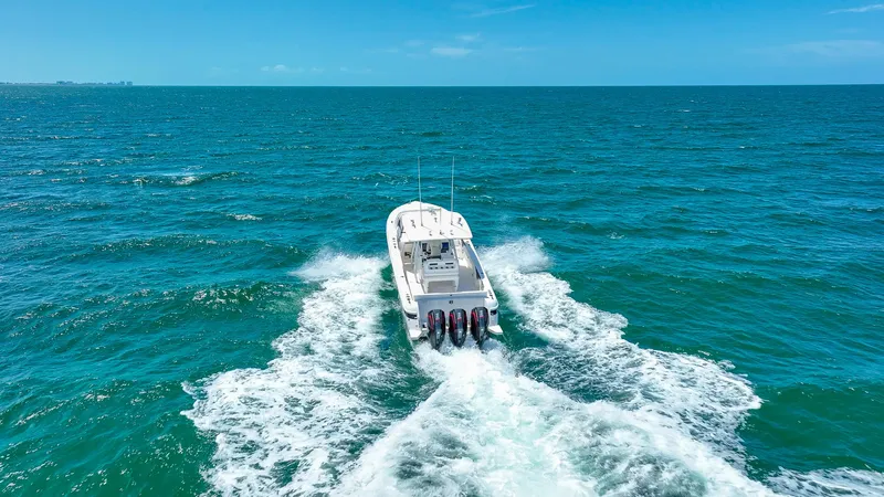 Slide: The Image of 2018 Intrepid 375 Open boat cruising on open ocean waters. - 13