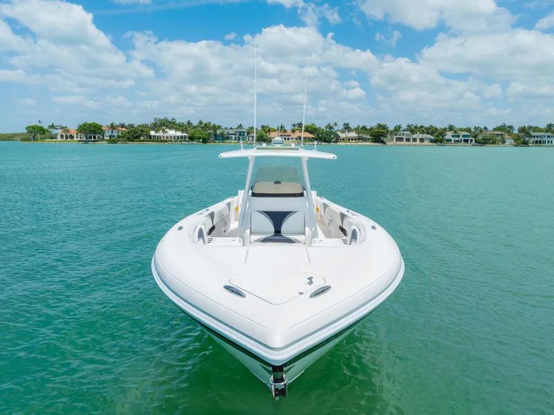 Slide: The Image of 2018 Intrepid 375 Open boat on turquoise water under blue sky. - 15