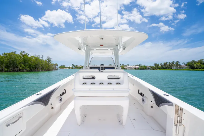 Slide: The Image of 2018 Intrepid 375 Open boat on clear water under blue sky. - 22