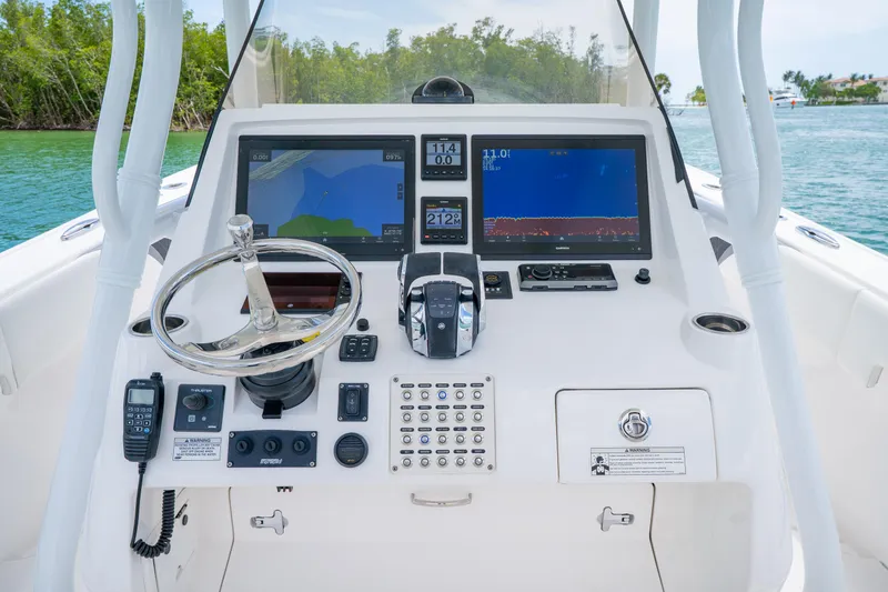 Slide: The Image of 2018 Intrepid 375 Open boat dashboard with navigation screens and controls. - 24