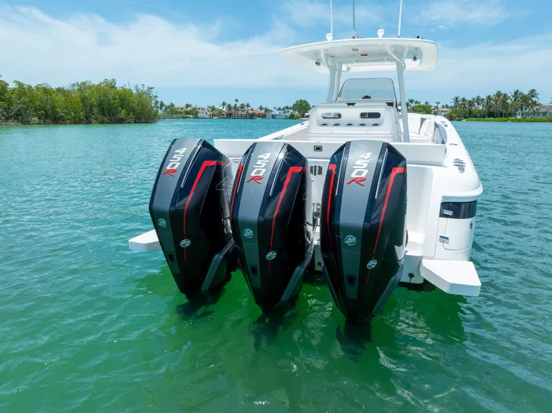 Slide: The Image of 2018 Intrepid 375 Open boat with triple outboard engines on clear water. - 3