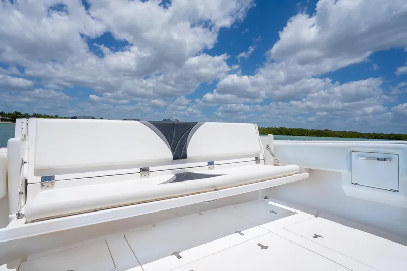 Slide: The Image of 2018 Intrepid 375 Open boat with white seating under a blue sky. - 5