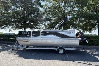 Slide: The Image of 2020 SunCatcher V20 Fish & Cruise pontoon boat on trailer, parked outdoors. - 7