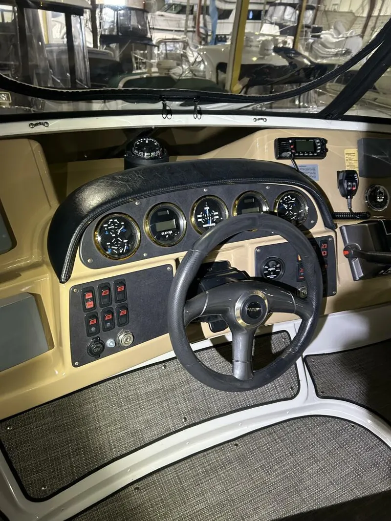 Slide: The Image of 2003 Carver 396 Aft Cabin MY helm with gauges and controls. - 24