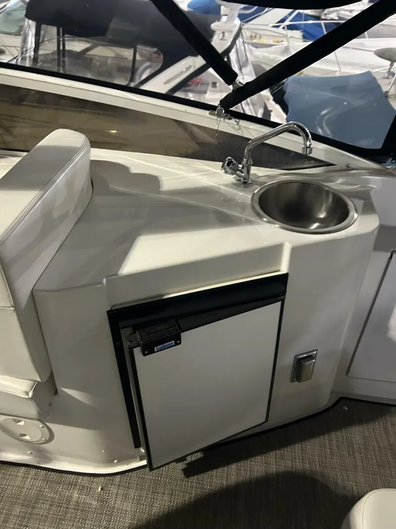 Slide: The Image of 2003 Carver 396 Aft Cabin MY yacht kitchenette with sink and mini fridge. - 28