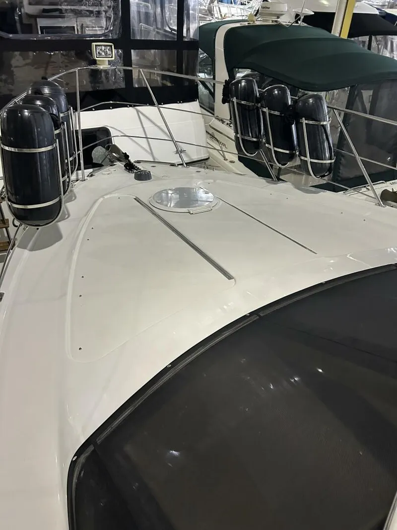 Slide: The Image of 2003 Carver 396 Aft Cabin MY yacht deck with fenders and railing. - 35