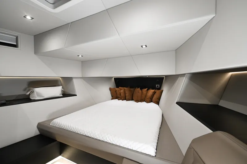 Slide: The Image of Luxurious interior of 2022 Vanquish VQ58 yacht with modern bed and ambient lighting. - 16