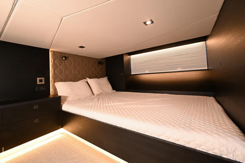 Slide: The Image of Luxurious bedroom interior of 2022 Vanquish VQ58 yacht with modern design and ambient lighting. - 21