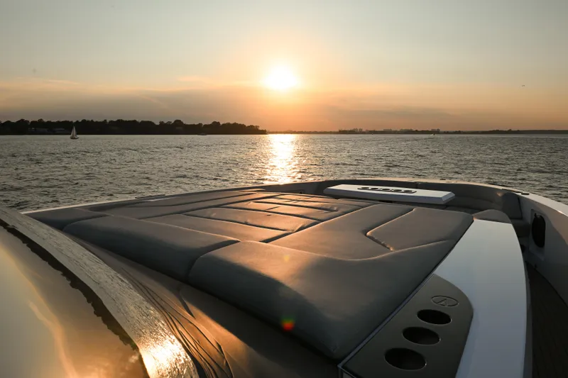 Slide: The Image of Sunset view from 2022 Vanquish VQ58 yacht deck on tranquil water. - 23