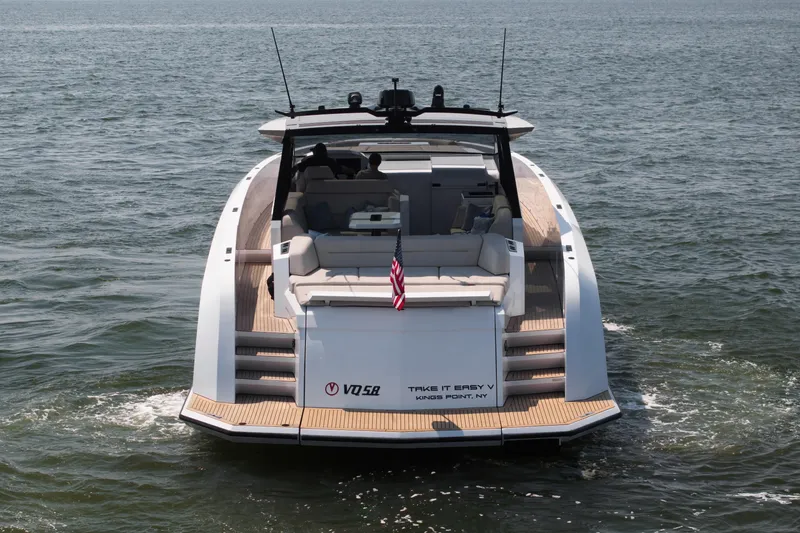 Slide: The Image of 2022 Vanquish VQ58 yacht cruising on open water, rear view. - 6