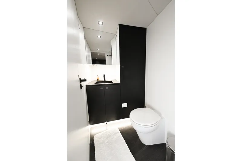 Slide: The Image of Modern bathroom in 2022 Vanquish VQ58 yacht with sleek design and minimalist fixtures. - 18