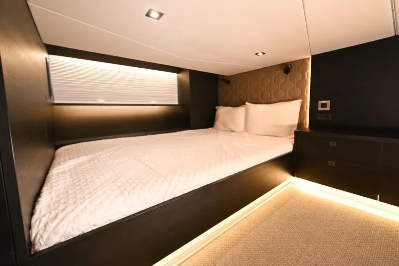 Slide: The Image of Luxurious 2022 Vanquish VQ58 yacht bedroom with modern lighting and elegant design. - 20