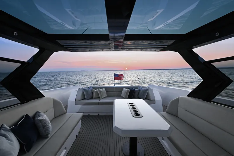 Slide: The Image of Luxurious 2022 Vanquish VQ58 yacht interior with ocean view at sunset. - 25
