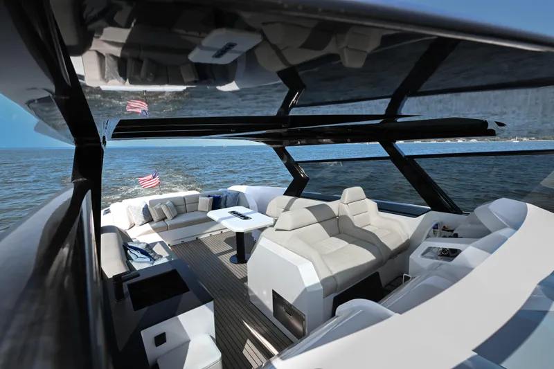 Slide: The Image of Luxurious 2022 Vanquish VQ58 yacht interior with sleek seating and ocean view. - 9